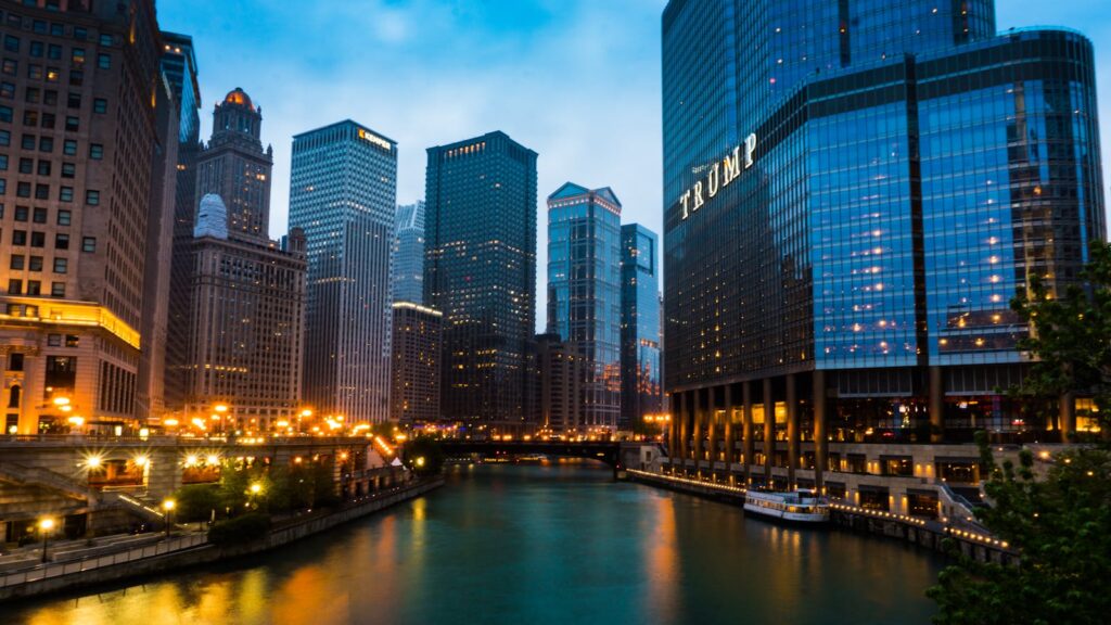 Captivating cityscape of Chicago's skyline with the iconic Trump Tower at dusk, reflecting vibrant urban life.